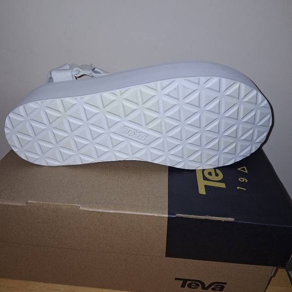 A pair of Teva W. Flatform Universal sandals in solid white in a ladies Size 9. - Picture 10 of 10